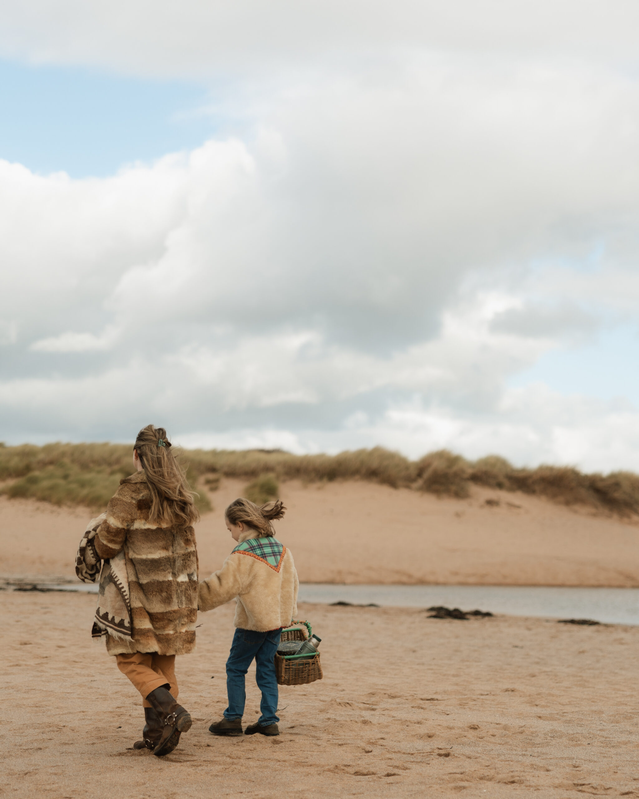 Mother and son walking on South Milton Beach